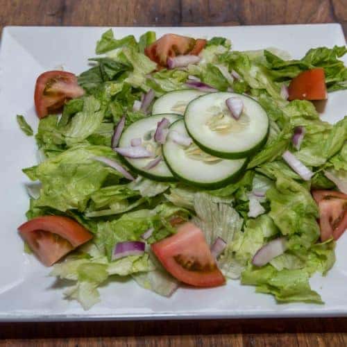 garden salad with tomatoes, onions, and cucumbers