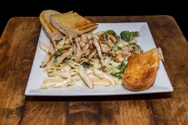 pasta with grilled chicken and broccoli with a side of toast