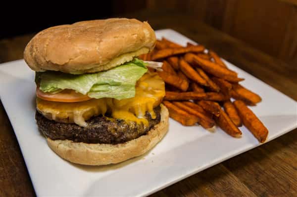 cheeseburger with tomato, lettuce and sweet potato fries