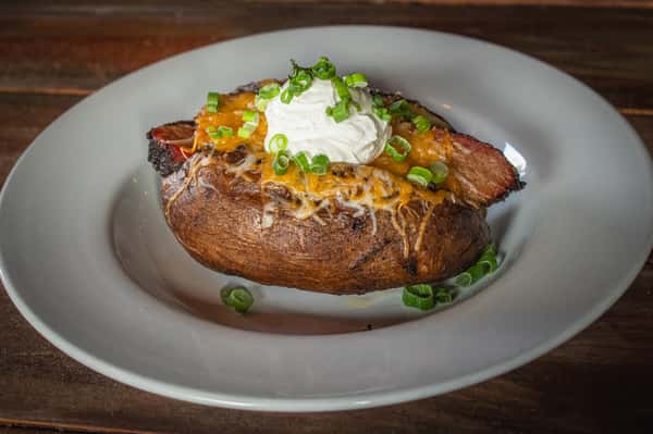 Baked potato your choice of slow smoked brisket, chicken or pork with
