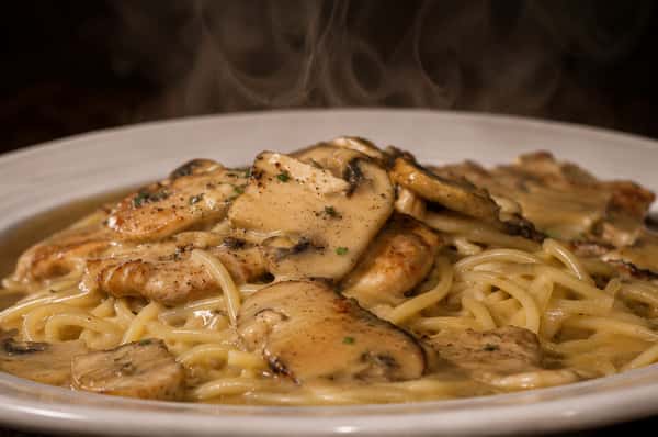 Chicken Marsala with mushrooms and pasta in a savory wine sauce