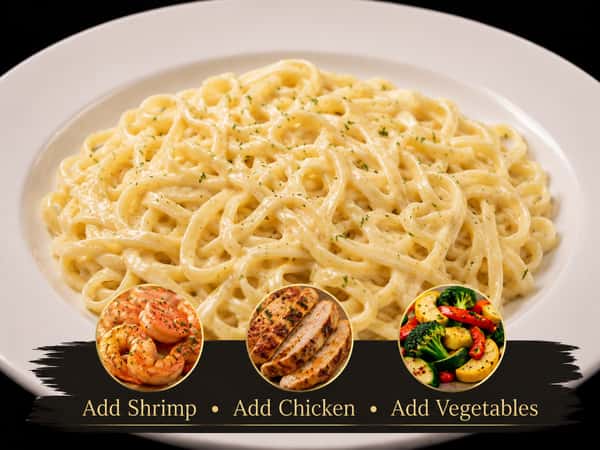 Fettuccine pasta tossed in a creamy Alfredo sauce and topped with Parmesan
