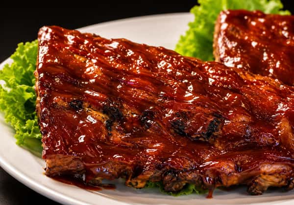 Barbecue ribs glazed with a rich barbecue sauce and served over lettuce