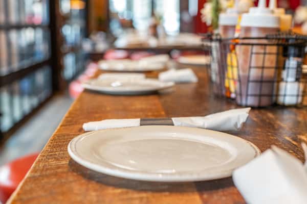 White place setting on a wood table