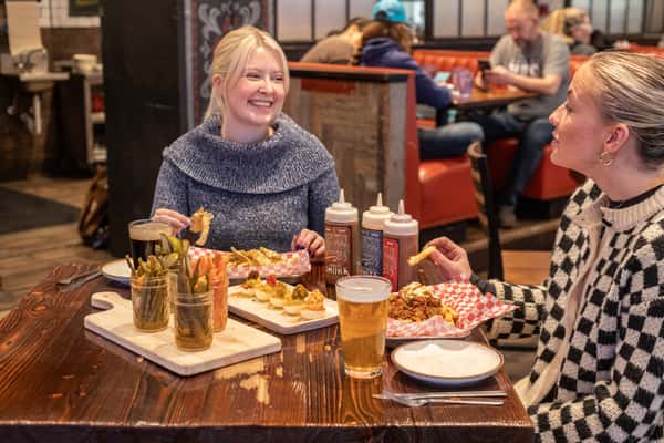 Guests enjoying dinner at NashHouse using reservations to reduce wait time