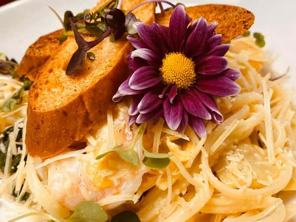 Shrimp Linguine: sauteed shrimp, spinach, marinated artichokes, garlic, lemon, butter, De Cecco linguine