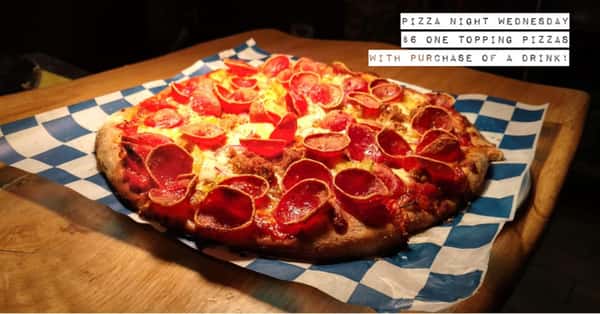 pizza pie topped with pepperoni