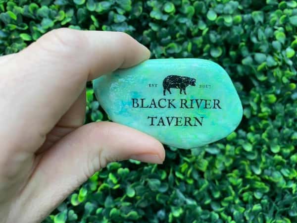 gemstone with the black river tavern logo