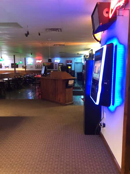 front of restaurant with lit kiosk