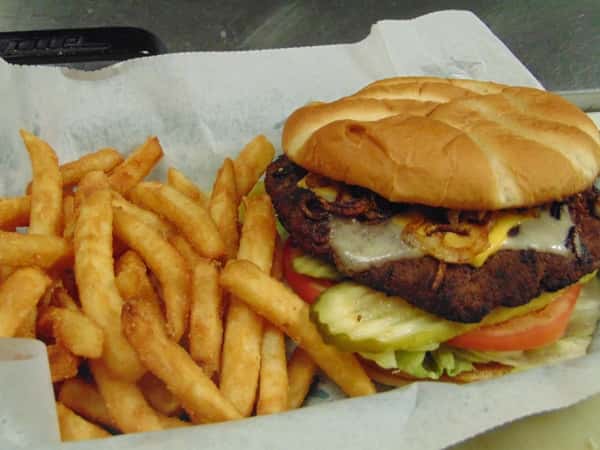 Chicken Club Sandwich with french fries on the side