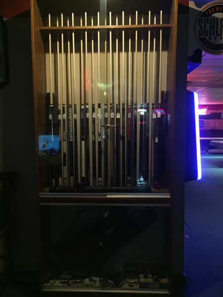 Pool Sticks hanging up in their case