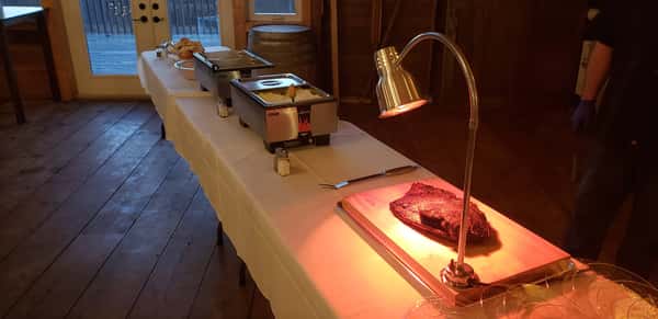 Table with brisket and catered spread