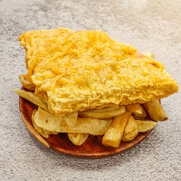 Large crispy battered fish fillet served with thick-cut golden chips