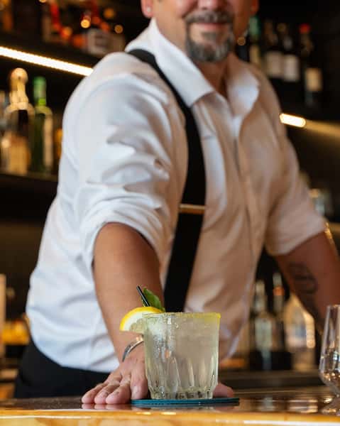 bartender presenting drink