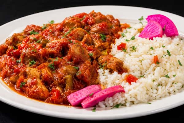 Sheikh al mahshi eggplant dish served with seasoned rice and pickled turnips
