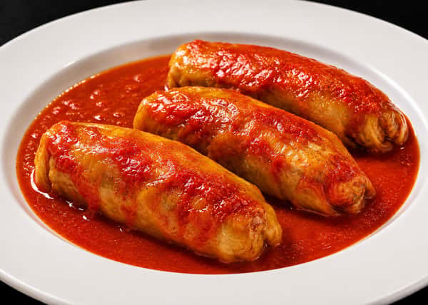 Stuffed squash cooked in tomato sauce
