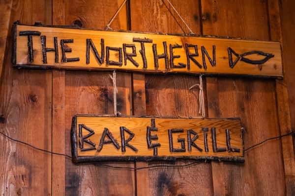 A wooden sign that reads "The Northern Bar & Grill"
