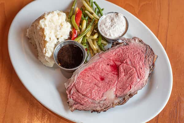 Juicy prime rib with au jus, horseradish sauce, mashed potatoes, and sautéed green beans with red peppers.