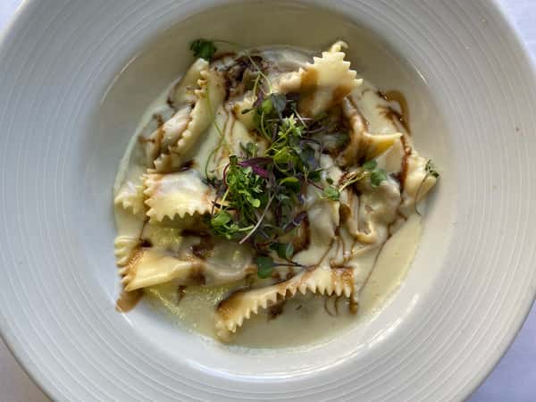 Beef Agnolotti with parmiggiano crema and balsamic demi glacé reduction  