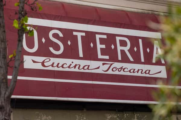 Osteria Cucina Toscana restaurant awning with classic Italian signage