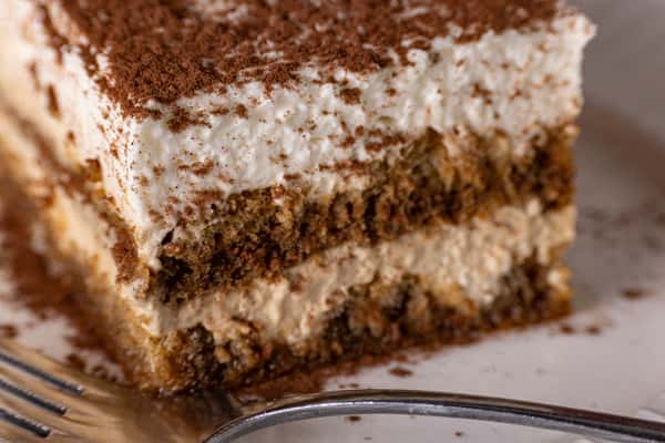 Classic tiramisu with mascarpone cream, espresso-soaked layers, and cocoa
