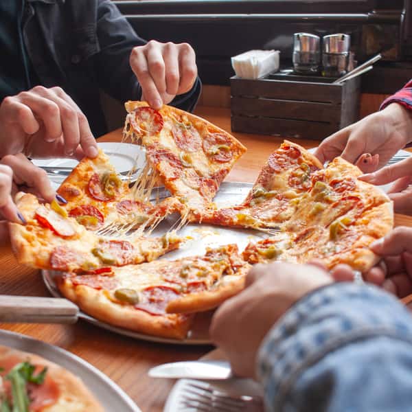 friends sharing pizza