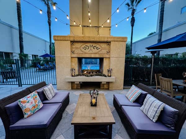 Outdoor patio seating with a fireplace