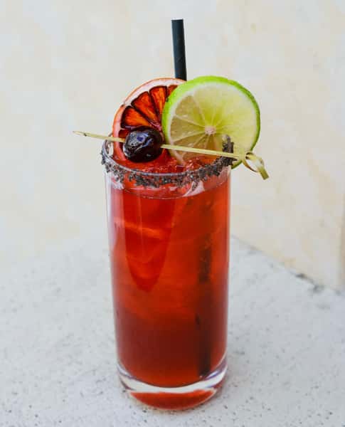 Specialty cocktail with two citrus slices