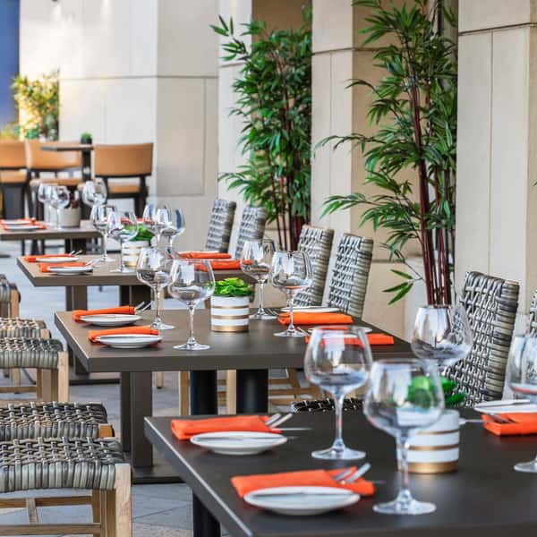 Patio dining tables with place settings