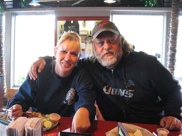 two people posing for picture