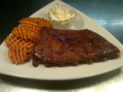coleslaw, waffle fries, and barbecue ribs
