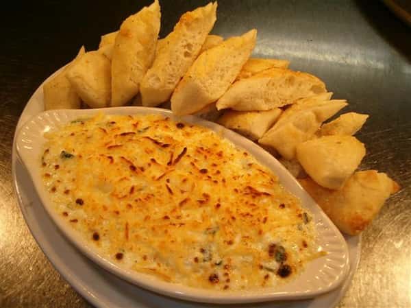 entree in a dish with bread on the side