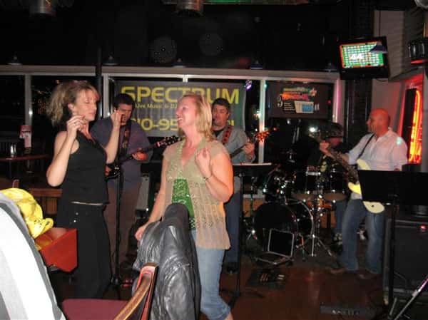 band playing while two females dance