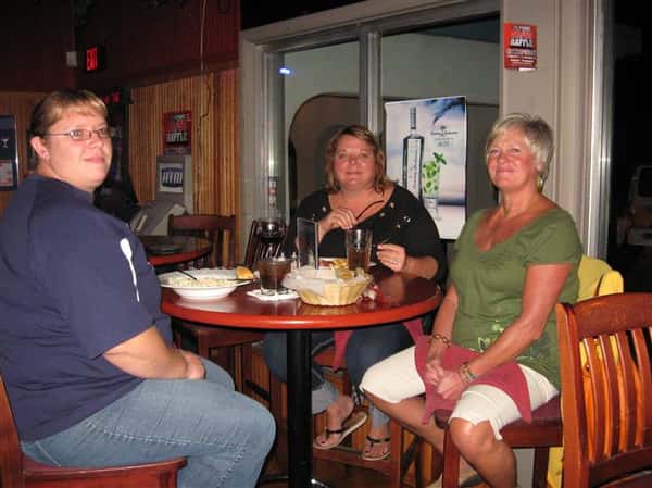 three females sitting at a table