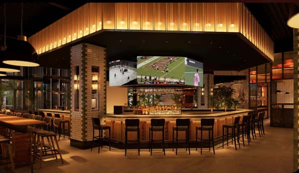 Bar area with large screens at Forbici St. Petersburg location