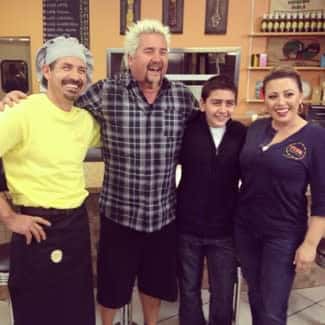 diners, drive-ins & dives star with perk eatery chef and owners