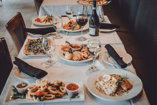 Multiple dishes and drinsk made by Mezza Luna