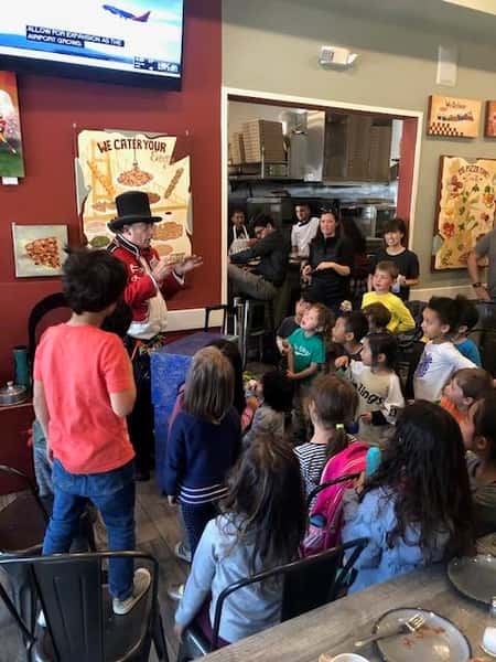 group of children watching a magic show