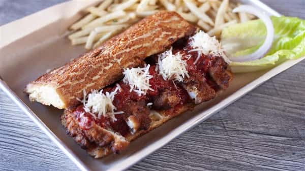 chicken parmesan hero with side of french fries