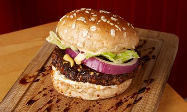 burger with onions and lettuce