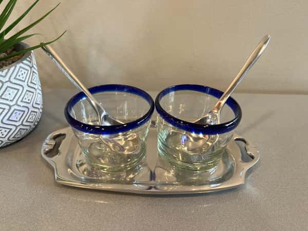 Glass salsa holders with pewter spoons and tray