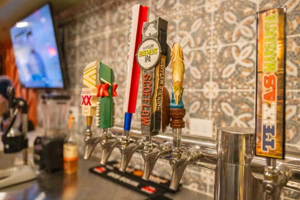 Craft beer tap handles including IPA and Mexican lager options at Tijuana Joe's full-service bar.
