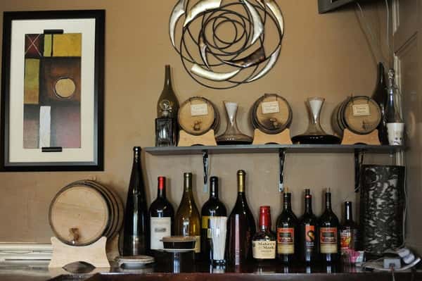 Bottles of wine and liquor lined up on table