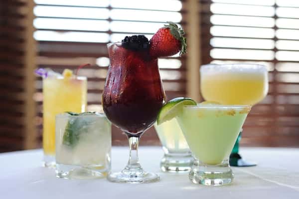 Variety of cocktails with fruit garnishes