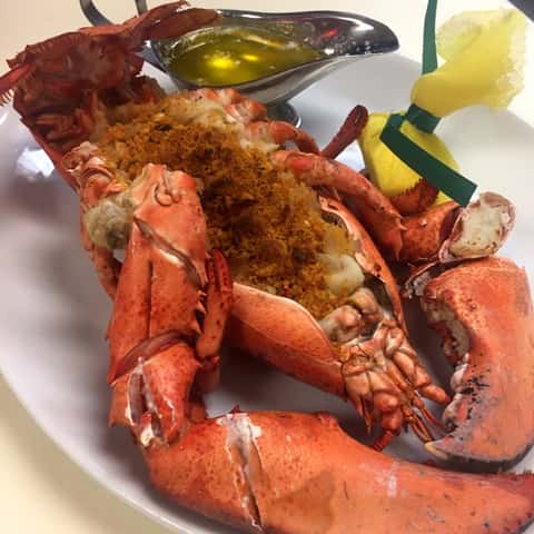 Steamed lobster and seasoning with melted butter