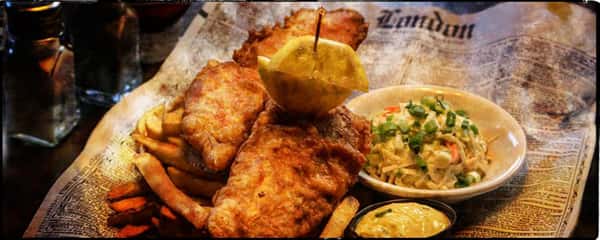 2 chicken tenders. one with a toothpick through the lemon and chicken