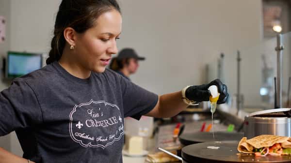 Chef preparing fresh French cuisine for a trusted food truck catering event in Atlanta, delivering high-quality service for corporate events, weddings, and private celebrations.