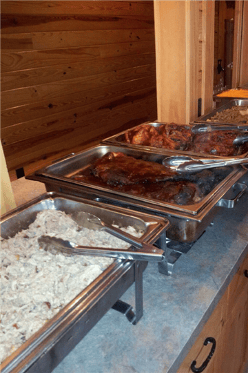 catering style buffet metal trays with bbq food