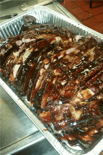 bbq brisket slices in a metal tray