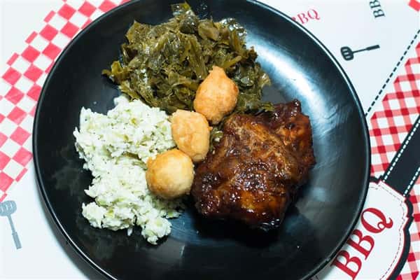 bbq chicken with vegetables and hush puppies